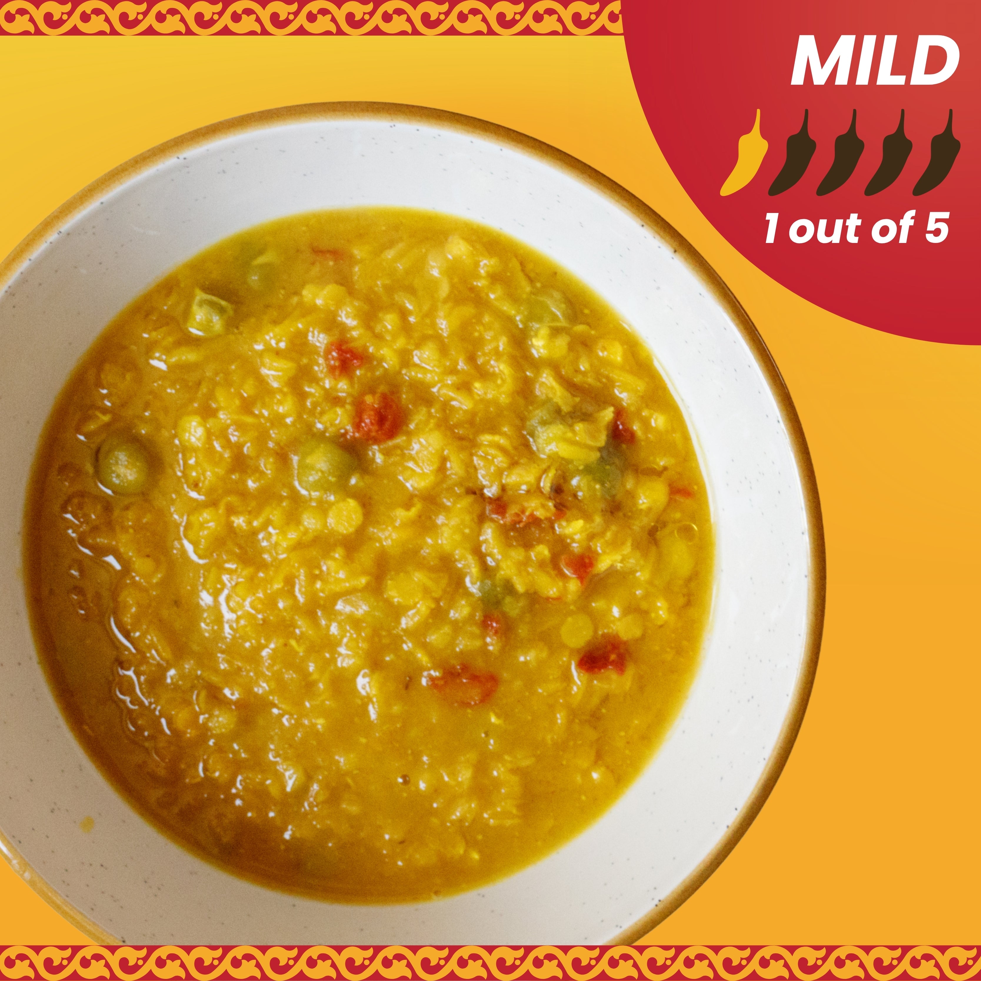 Yellow soup in a white bowl on an orange background with a mild spice level indicator.