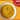 Yellow soup in a white bowl on an orange background with a mild spice level indicator.