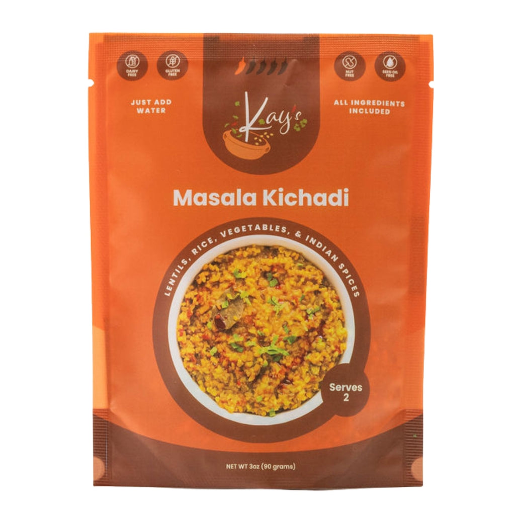 A package of Kay's Masala Kichadi, featuring an orange and brown stand-up pouch with a photo of the prepared food on the front, set against a plain white background.