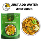 A green pouch of Kay's Vegetable Biryani shown next to a white bowl filled with cooked biryani rice garnished with cilantro and a lime wedge. Large text at the top reads 'JUST ADD WATER AND COOK' with a 15-minute icon.