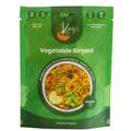 Green package of Kajis Vegetable Biryani on a white background