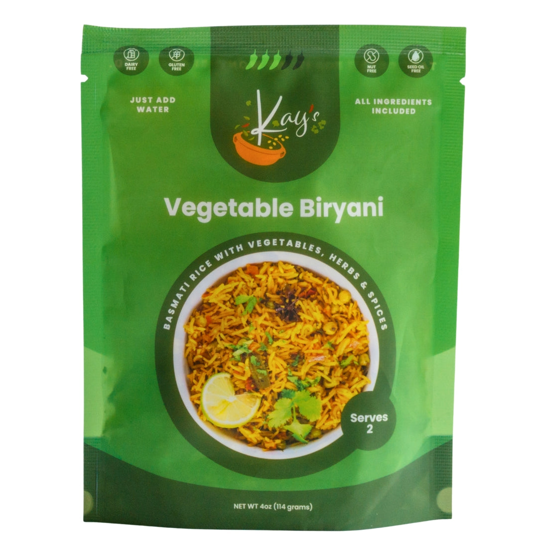 Green package of Kajis Vegetable Biryani on a white background