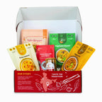 Kay's Curries Biryani Lover Box in a red gift box with Tofu Biryani, Vegetable Biryani, Pappu Dal, Kesar Halwa, Omni-Masala and Masala Tea