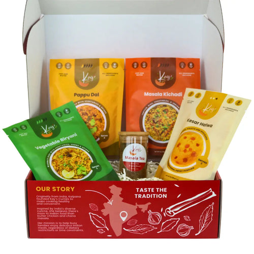 Kay's Curries Comfort Classics in a red gift box with Vegetable Biryani, Masala Kichadi, Pappu Dal, Kesar Halwa and Masala Tea