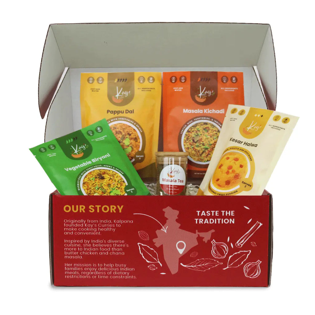 Kay's Curries Comfort Classics Box in a red gift box with Vegetable Biryani, Masala Kichadi, Pappu Dal, Kesar Halwa and Masala Tea