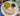 White plate with roti, palak paneer, and chana